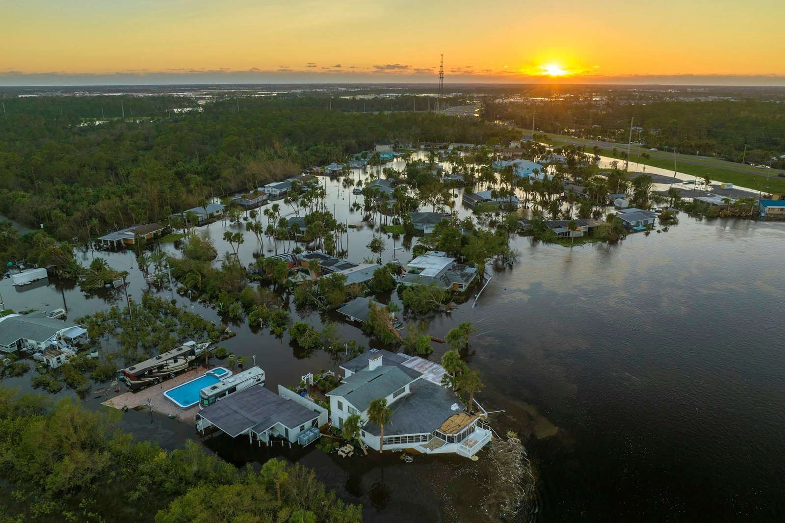 Aftermath of natural disaster. Surrounded by hurricane Ian rainfall flood waters homes